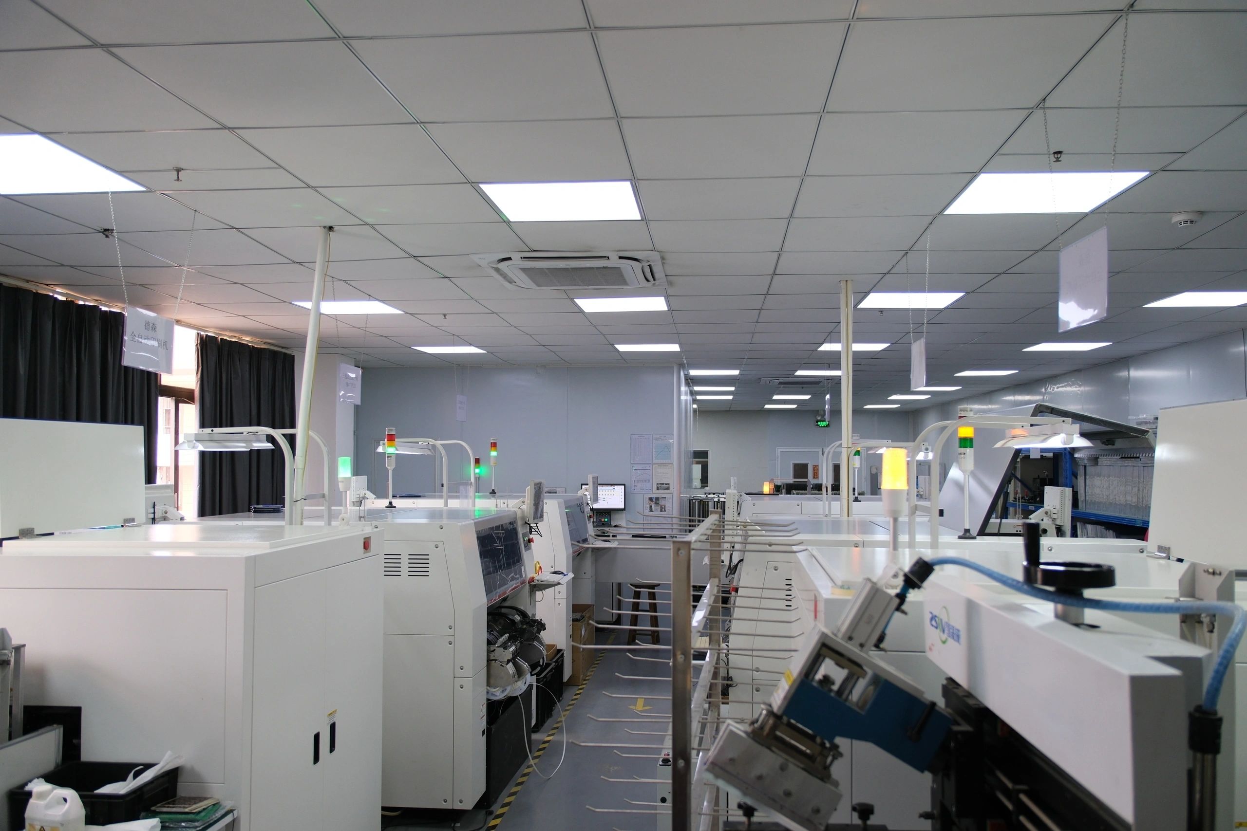 SMT equipment arranged along an electronics production floor